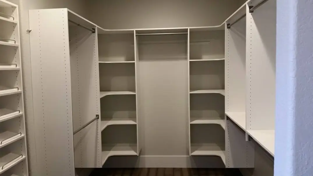 built in closet design with shoe shelves and hanging rods fully customized