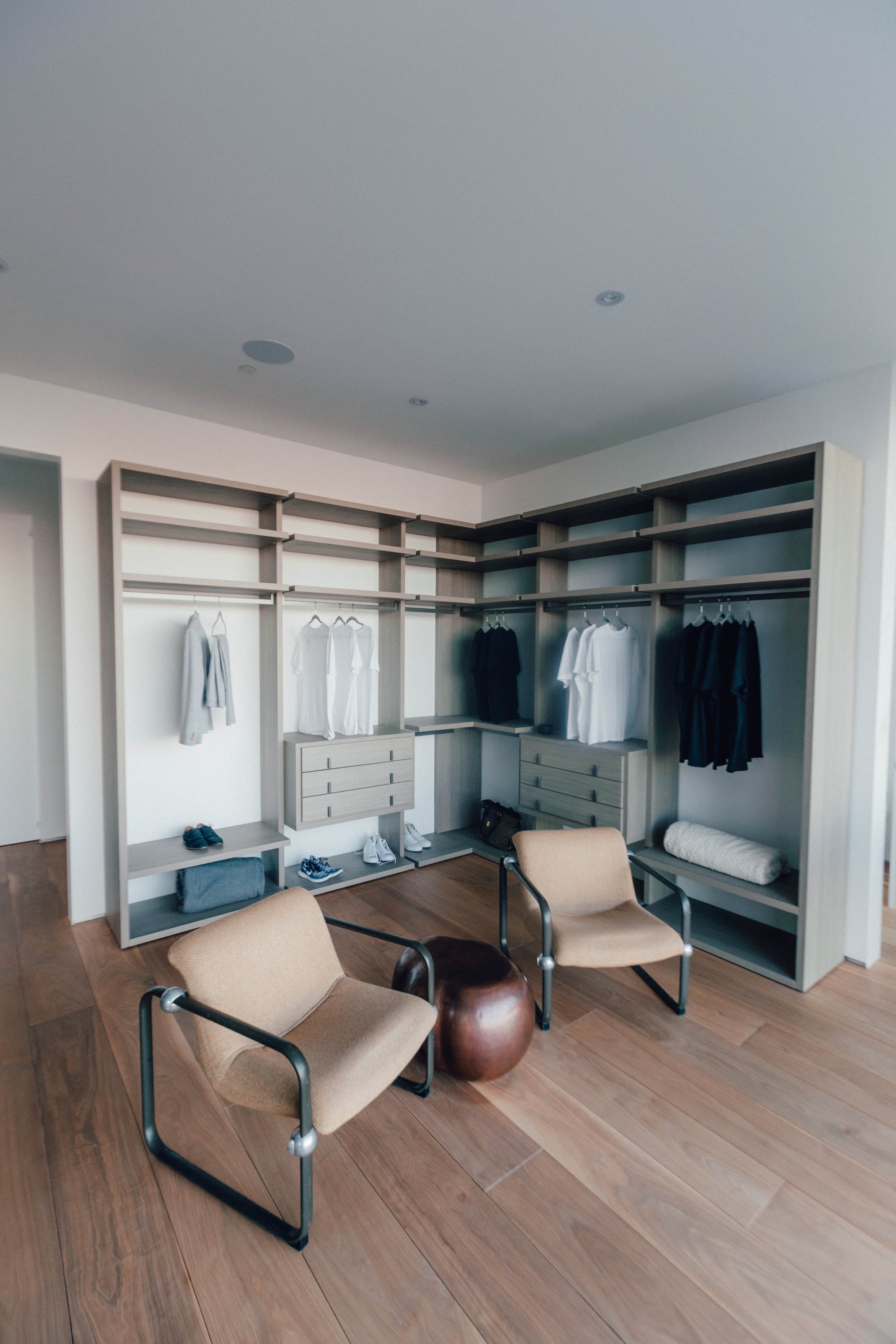 custom closet with shelving and hanger rods built on wall non built in closet design